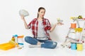 Woman holds bundle of cash money, supermarket grocery push cart for shopping. Instruments for renovation apartment