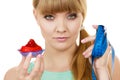 Woman holds cupcake trying to resist temptation Royalty Free Stock Photo