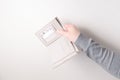 woman holds empty beige leather wallet with white paper in her pocket Royalty Free Stock Photo