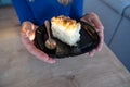 The woman holds food in her hand. the girl holds in her hands. Cake on plate Royalty Free Stock Photo