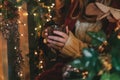 Woman holds glass with mulled wine Royalty Free Stock Photo