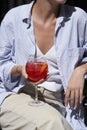 Woman holds glass with red cocktail, close-up Royalty Free Stock Photo