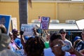 A woman holds a `God Bless Every Vote` sign in vote counting protest outside Broward County Supervisor of Elections office