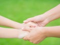 Woman holds the hand of lovely child. Royalty Free Stock Photo