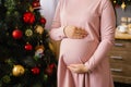 Woman holds hands on her pregnant belly Royalty Free Stock Photo