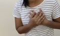 Woman holds hands on painful chest.Medical concept. Heart attack.