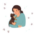 A woman holds a labrador retriever puppy in her arms Royalty Free Stock Photo