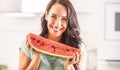 Woman holds a large piece of watermelon, smiling Royalty Free Stock Photo