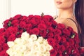 Woman holds luxury bouquet of red roses. Love you. Celebration of engagement or wedding. Happy Valentine`s Day