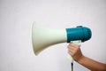 A woman holds a megaphone in her hand Royalty Free Stock Photo