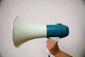 A woman holds a megaphone in her hand Royalty Free Stock Photo