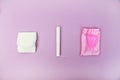 A woman holds a menstrual cup in her hand on a pink background. The concept of women`s health, hygiene, alternatives pads and