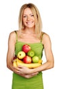 Woman holds a pile of fruit Royalty Free Stock Photo