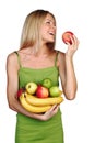 Woman holds a pile of fruit Royalty Free Stock Photo