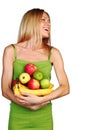 Woman holds a pile of fruit Royalty Free Stock Photo