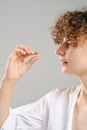 Woman holds pill in hand Royalty Free Stock Photo