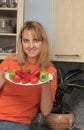Woman holds a plate with vegetables Royalty Free Stock Photo