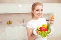 Woman holds plate with vegetables Royalty Free Stock Photo