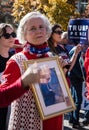 A Woman Holds a Religious Picture at a Stop the Steal Rally Royalty Free Stock Photo