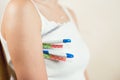 Woman holds several thermometers of different types at once Royalty Free Stock Photo