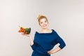 Woman holds shopping basket with vegetables Royalty Free Stock Photo