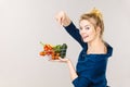 Woman holds shopping basket with vegetables Royalty Free Stock Photo