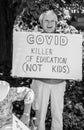 A Woman Holds a Sign Protesting School Closures due to COVID-19 Royalty Free Stock Photo