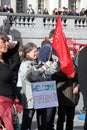 A woman holds a sign saying `Welcome Foreigners` during a rally in London`s Trafalgar Square