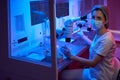 Woman holds a special pipette in her hand