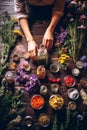 A woman holds supplements in her hands with herbs and flowers. Generative AI, Royalty Free Stock Photo