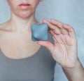 A woman holds a trigger point massage ball used for muscle pain treatment and deep tissue massage Royalty Free Stock Photo