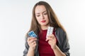 Woman holds two types of drugs Royalty Free Stock Photo