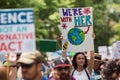 Woman Holds Up Sign Marching At Atlanta Earth Day March