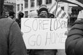 Woman Holds up a Sign `Sore Losers Go Home` at an Armed Demonstration at the Ohio Statehouse Ahead of Biden`s Inauguration