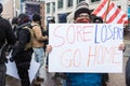 Woman Holds up a Sign `Sore Losers Go Home` at an Armed Demonstration at the Ohio Statehouse Ahead of Biden`s Inauguration Royalty Free Stock Photo