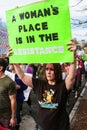 Woman Holds Up Sign Walking In Trump Protest March