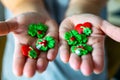 Woman holds various lucky charms in her hands, there are shamrocks, hearts and mushrooms