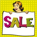 Woman holds white paper poster with Sale sign. Pop art comic retro style vector illustration. Royalty Free Stock Photo