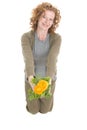 Woman holds yellow plant Royalty Free Stock Photo