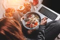 Woman in home clothes eating vegan Rice coconut porridge with figs, berries, nuts. Healthy breakfast ingredients Royalty Free Stock Photo