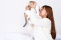 Woman at home holding her lovely fluffy cat. Multicolor tabby cute kitten. Pets and lifestyle concept Royalty Free Stock Photo
