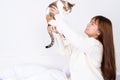 Woman at home holding her lovely fluffy cat. Multicolor tabby cute kitten. Pets and lifestyle concept Royalty Free Stock Photo