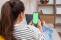 woman at home holding smartphone with chroma key, health appointment with doctor via an online call Royalty Free Stock Photo