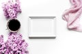 Woman home office with lilic flowers and frame white desk background top view mock up