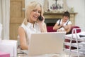 Woman in home office with mother and baby Royalty Free Stock Photo