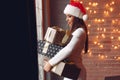 Beautiful girl standing near window with presents Royalty Free Stock Photo