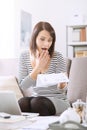 Woman checking her electricity bill Royalty Free Stock Photo