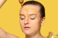 Woman with honey on her face