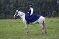 A woman horse rider at Borodino battle historical reenactment in Russia