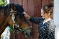 Woman with horse in stable at countryside ranch. Girl horse rider in summer outdoor. Equestrian and horseback riding. Horse Royalty Free Stock Photo